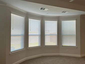 Bay window with faux wood blinds