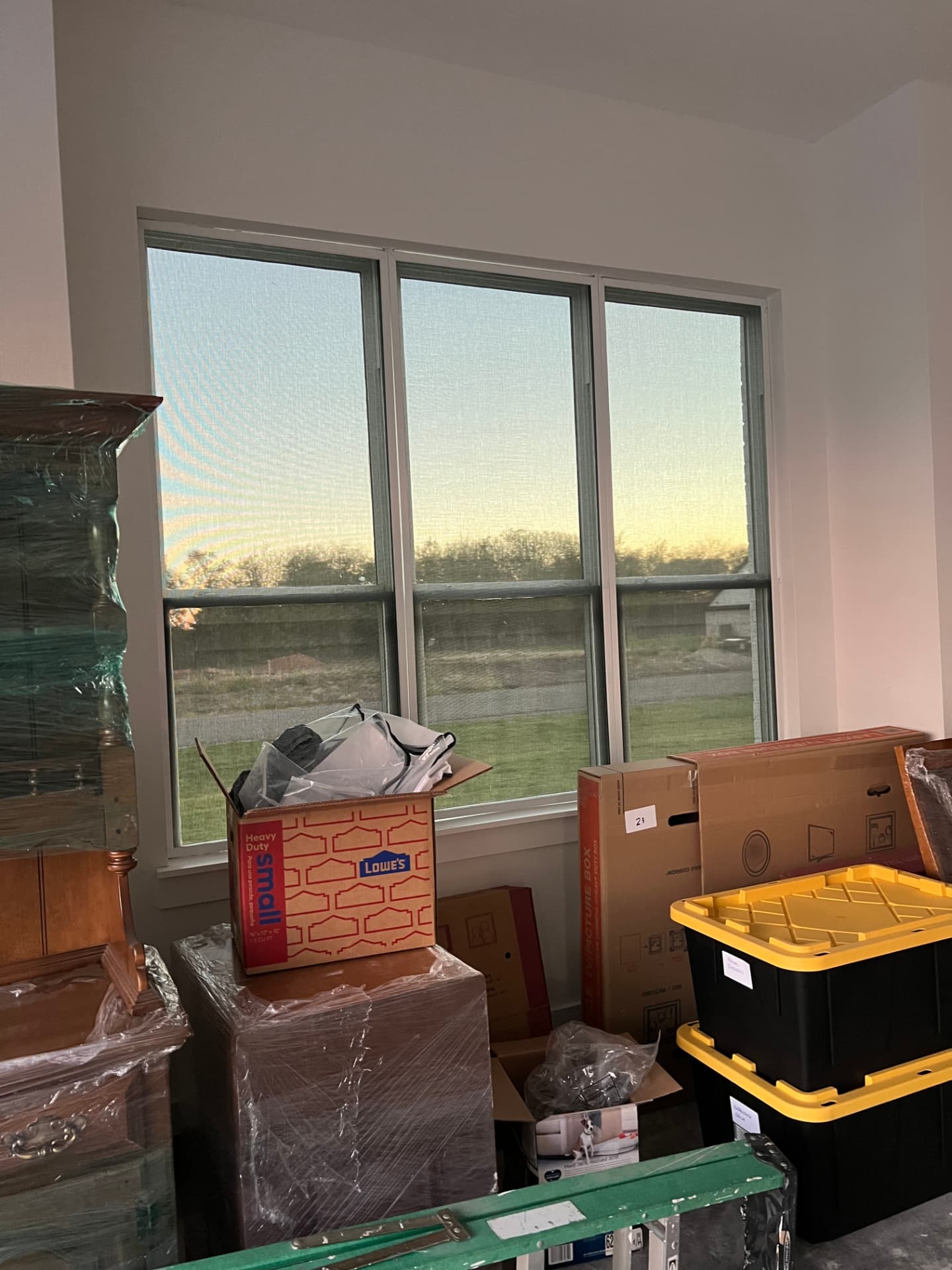 Interior view of three windows with Optex solar screens at sunset