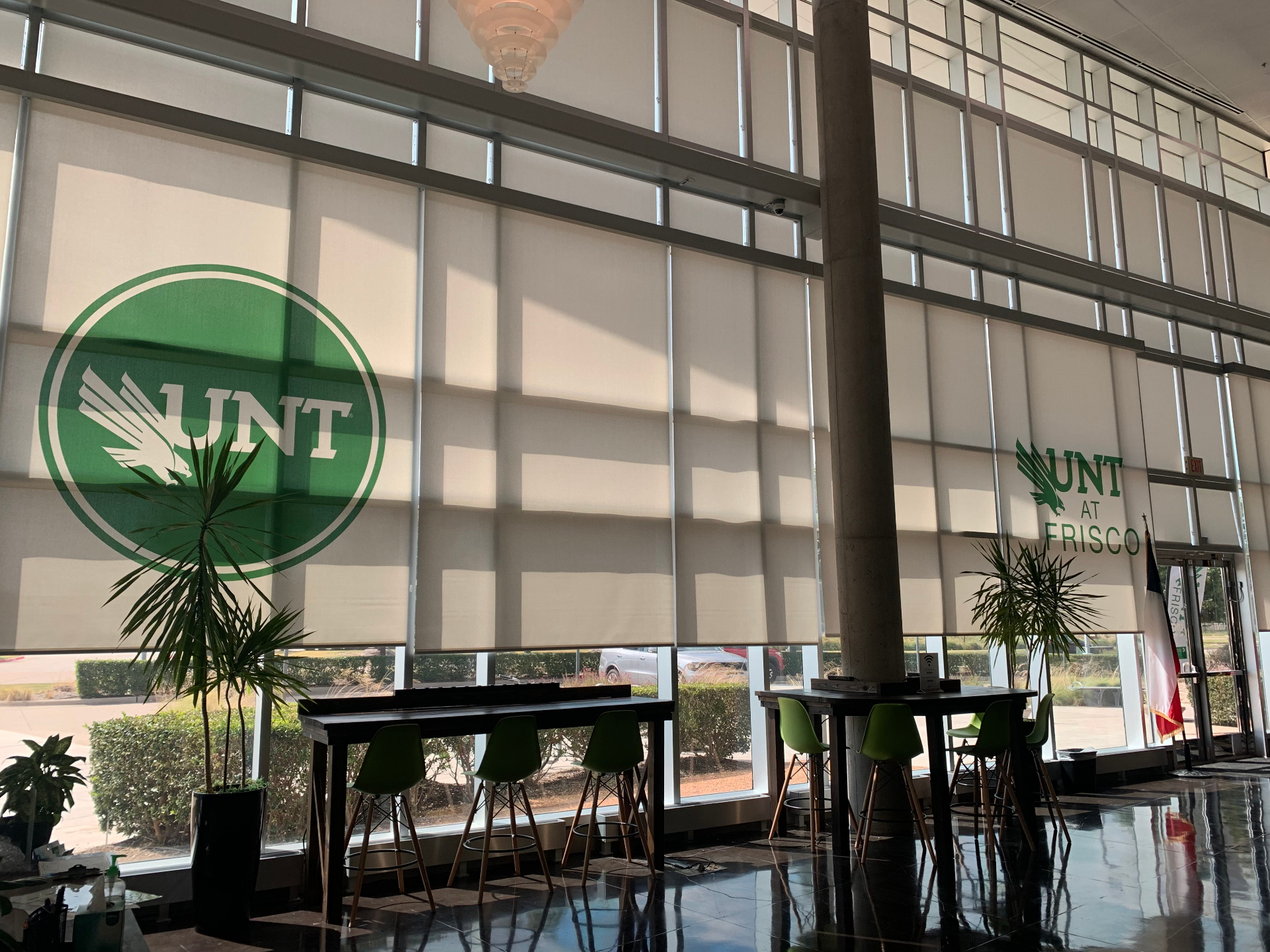 University lobby with printed graphic roller shades